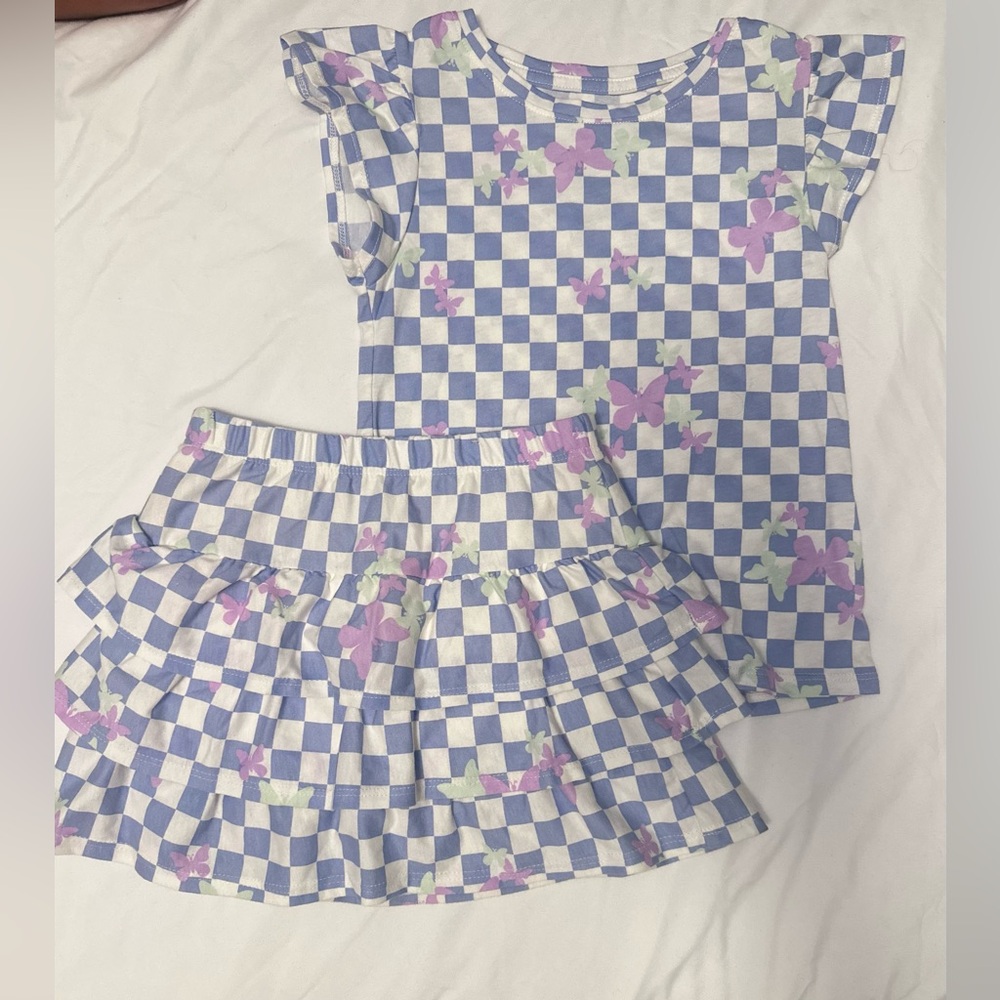 Blue and White Checkered Outfit with Floral Accents